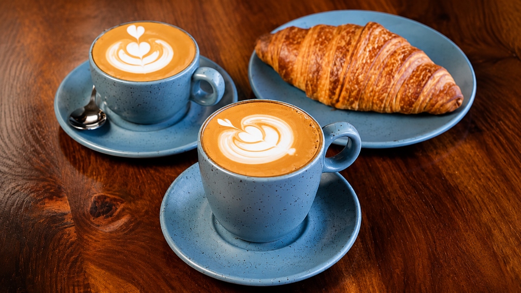 Morning cappuccino and fresh butter croissant pair
